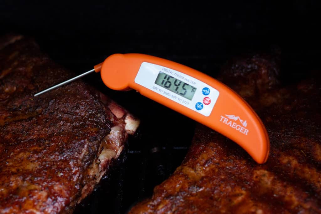 https://www.smokedmeatsunday.com/wp-content/uploads/2021/10/traeger-instant-read-thermometer-ribs-1024x683.jpg